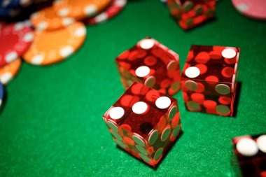 Live roulette and blackjack tables displayed on mobile phone showing live dealer video and betting interface